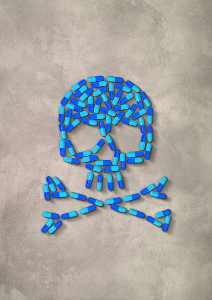 Skull made of blue capsule pills isolated on concrete background. 3D illustration - Valokuva, kuva