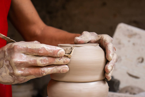 Ceramics on the elaboration process at a traditional factory at the beautiful small city of Raquira in Colombia - Foto, imagen