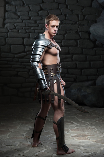 Gladiator with sword posing - Fotó, kép