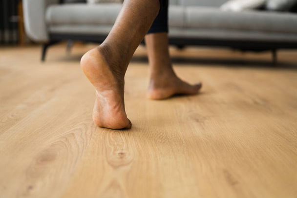 African Barefoot Woman Walking On Heated Floor In Living Room - Zdjęcie, obraz