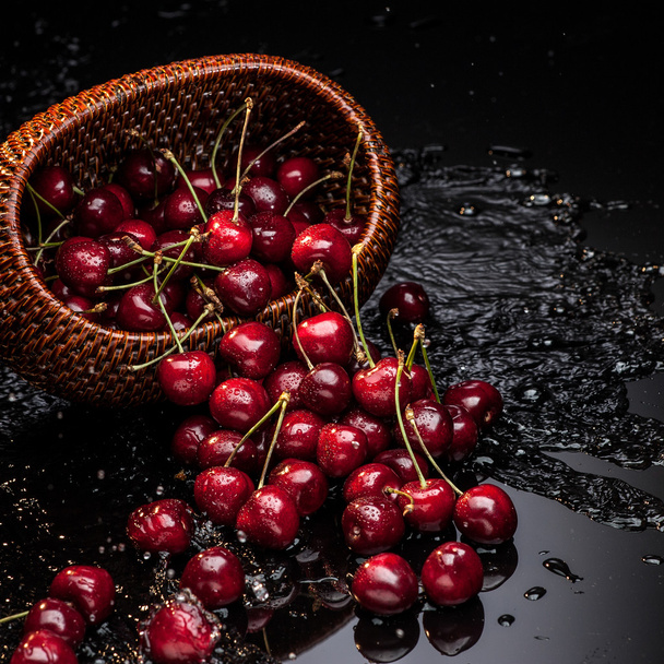 cherry falling from basket - Valokuva, kuva