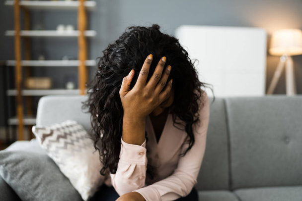 Depressed Sad Young Girl With Headache Sitting At Home - Valokuva, kuva
