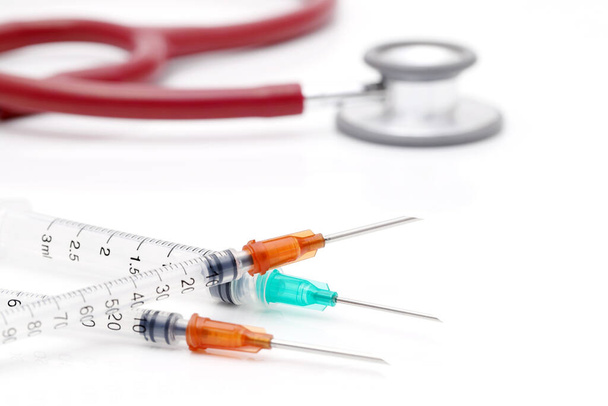 medicine diagnosis and prescription, syringe, stethoscope - 写真・画像