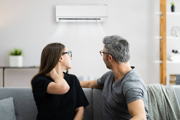 Air Conditioner Couple Sneezing And Having Sore Neck - Photo, image