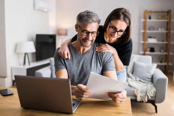 Couple Doing Taxes And Family Budget On Computer - Photo, image
