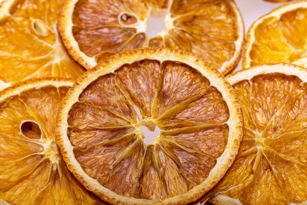 dried orange slices on a white background - Foto, Imagen