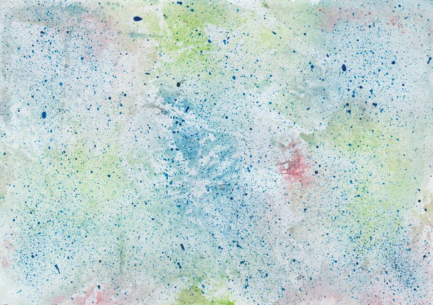 Watercolor wash background in blue, red and green with paint splashes in blue - Foto, afbeelding