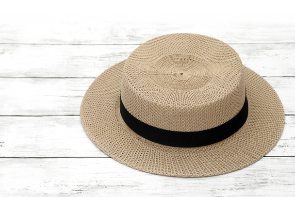straw lady hat on white wooden table - Фото, изображение