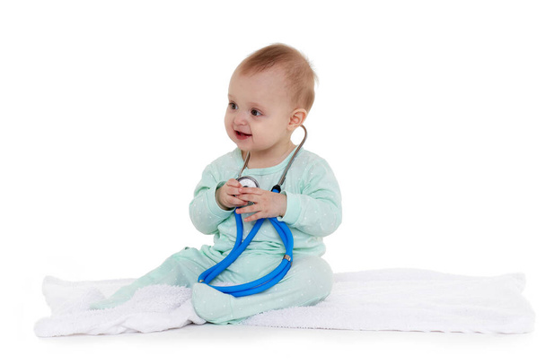 cute little baby girl with stethoscope on white background - Foto, Bild