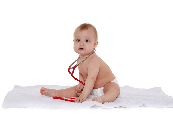 cute little baby boy with stethoscope on white background - Foto, Imagen