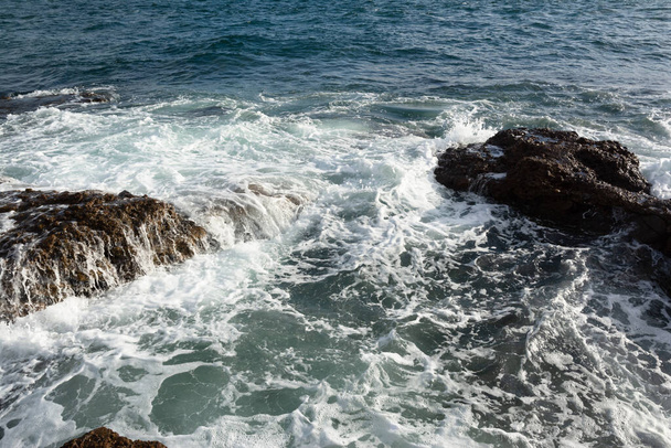 Waves breaking on the rocks of Ponta do Humaita. Salvador Bahia Brazil. - Fotografie, Obrázek