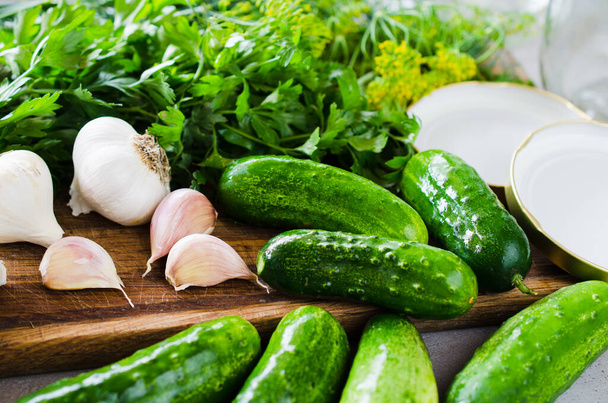 Conservation of fresh green cucumbers for the winter. Preparation marinated salted cucumbers with herbs and spice. Cucumbers with garlic, salt, dill. Pickles in jar, homemade preserved vegetables. - Fotoğraf, Görsel