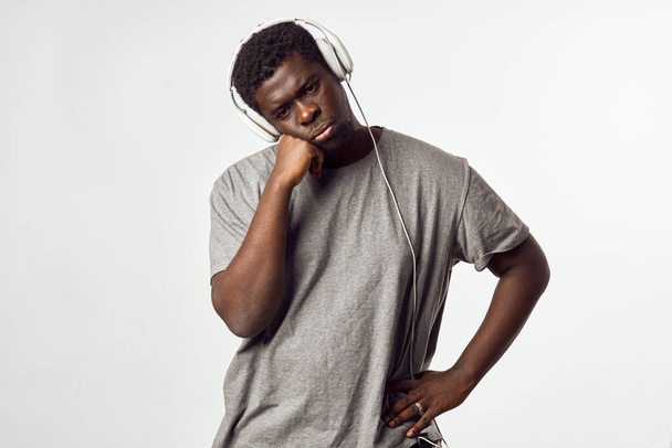 man with headphones listening to music african appearance entertainment - Photo, Image