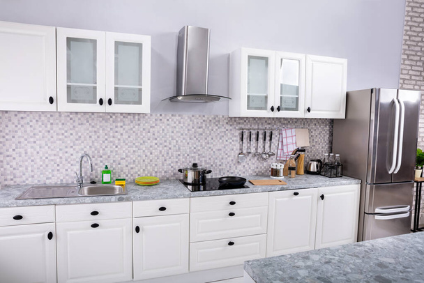Interior Of Modern White Clean Kitchen With Microwave Oven And Refrigerator - Foto, Imagem