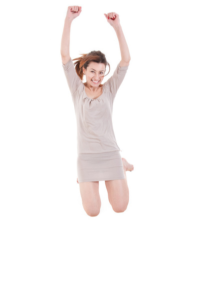 Attractive young woman having fun jumping in the air barefoot - Fotoğraf, Görsel