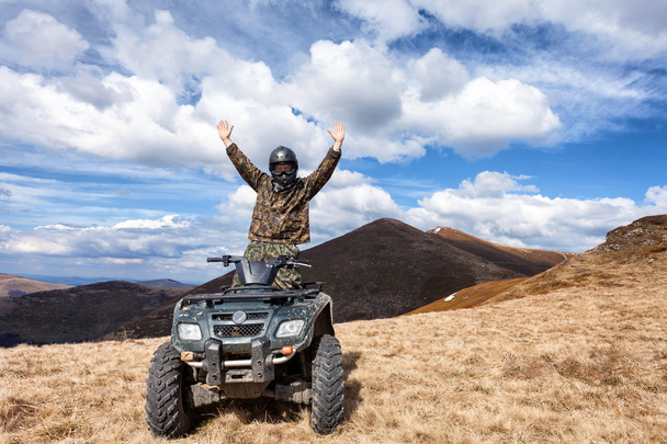 male rider on ATV at mountain top - Photo, Image