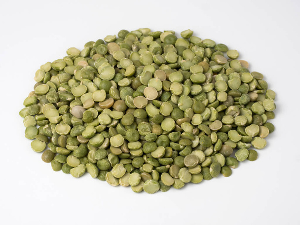Green dry peas in a pile isolated on a white background. - Photo, image