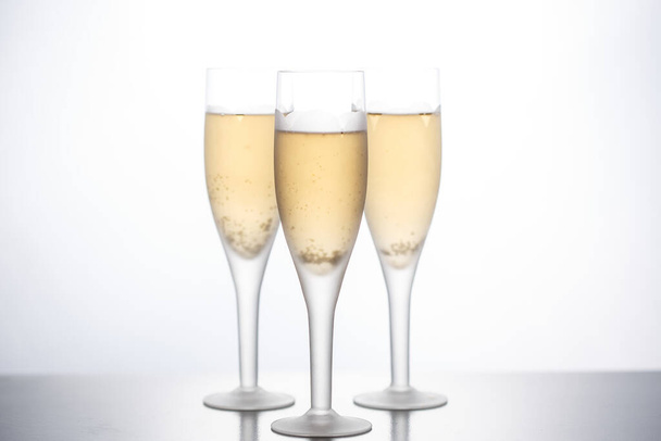 glasses of champagne on a white background. front view - 写真・画像