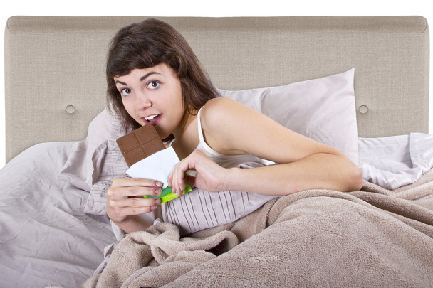 Girl eating junk food before going to bed - Photo, image