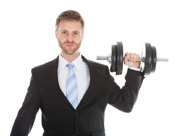 Businessman Lifting Dumbbell - Foto, afbeelding