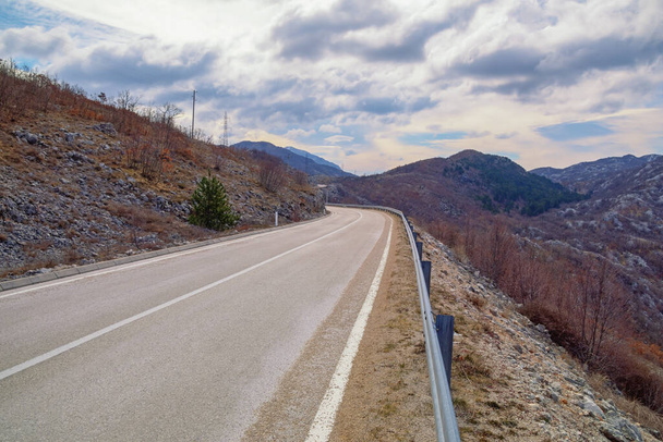 Balkan road trip.  Beautiful overcast landscape with road in Dinaric Alps mountains. Bosnia and Herzegovina, Republika Srpska - Photo, Image