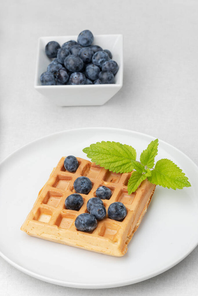 belgian waffle with blueberries - Фото, изображение