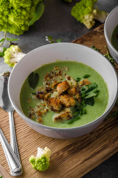 Green cauliflower soup, croutons from bread, delish soup - Photo, Image