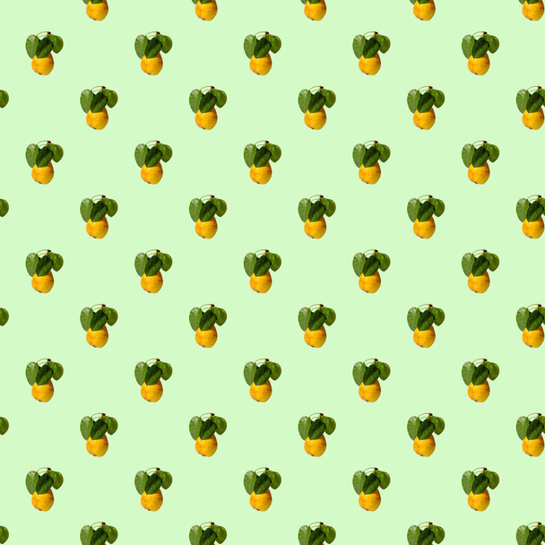 Ripe juicy yellow pears with green leaves on a colored background. Seamless patterns. - Photo, image