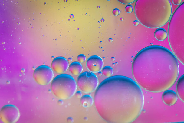 Oil drops in water. Abstract psychedelic pattern image multicolored. Abstract background with colorful gradient colors. - Photo, Image