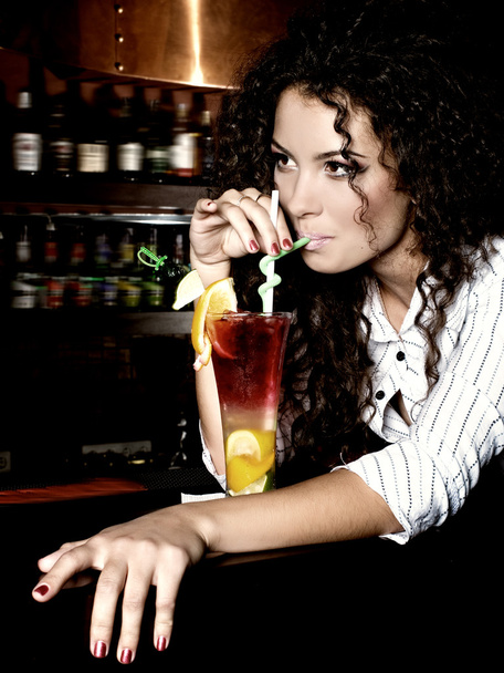 Brunette girl  with coctail in bar - Photo, image