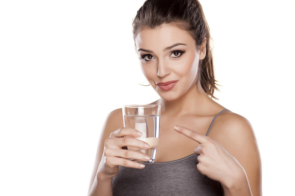 Woman holding a glass of water - Photo, Image