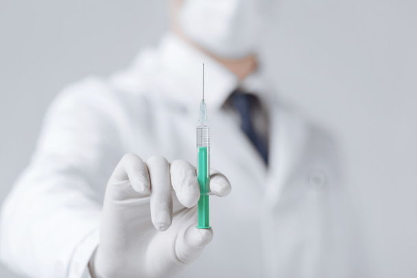 male doctor holding syringe with injection - Photo, Image