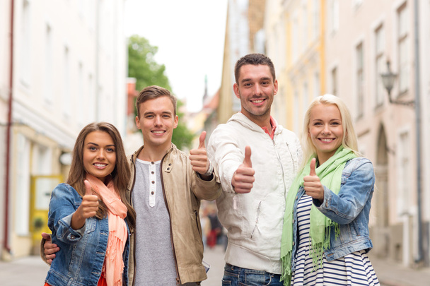 group of smiling friends showing thumbs up - Фото, зображення