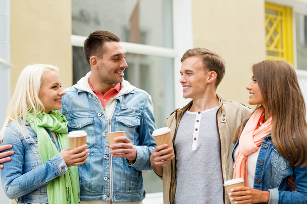 group of smiling friends with take away coffee - Zdjęcie, obraz