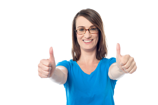 Woman gesturing double thumbs up - 写真・画像