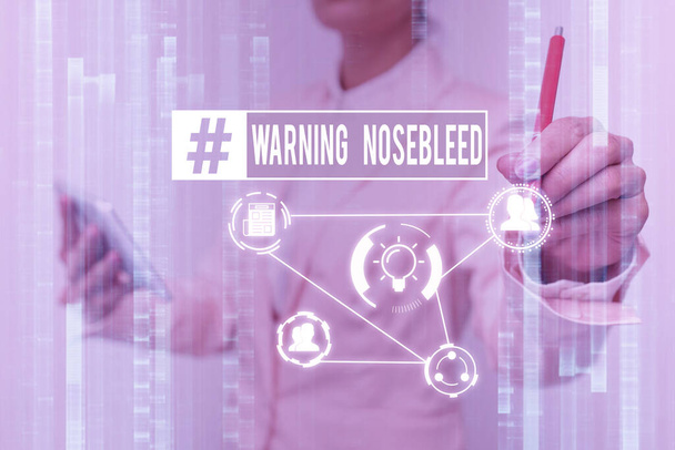Conceptual display Warning Nosebleed. Word Written on caution on bleeding from the blood vessels in the nose Lady In Uniform Touching And Using Futuristic Holographic Technology. - Photo, Image