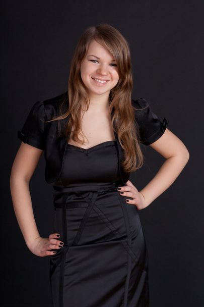 Young girl in black dress - Fotó, kép
