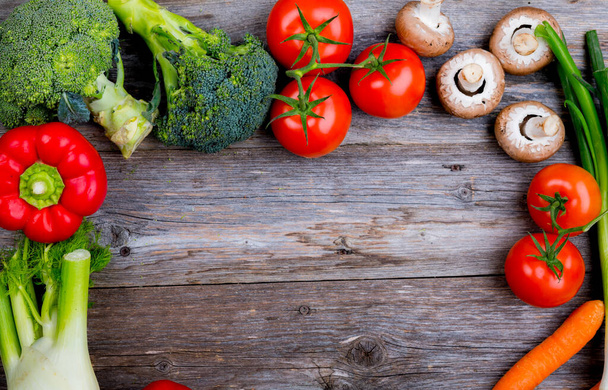 fresh vegetables and fruits on wooden background - Foto, Bild