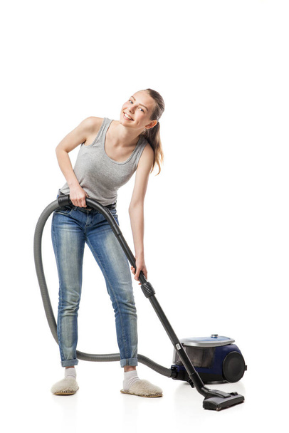 woman posing with vacuum cleaner over white - Foto, Imagem