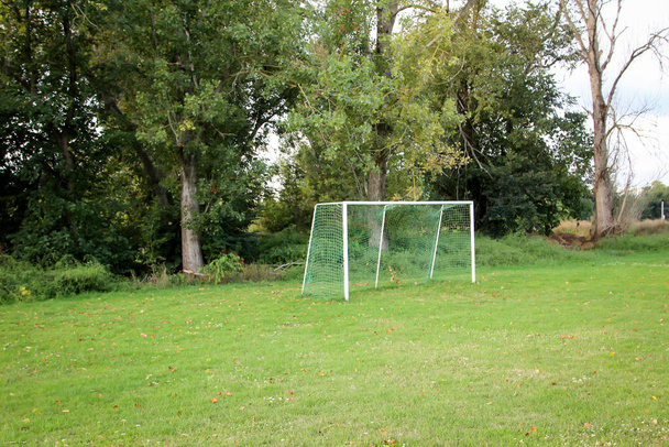 a soccer goal stands lonely on a sports field - Foto, afbeelding