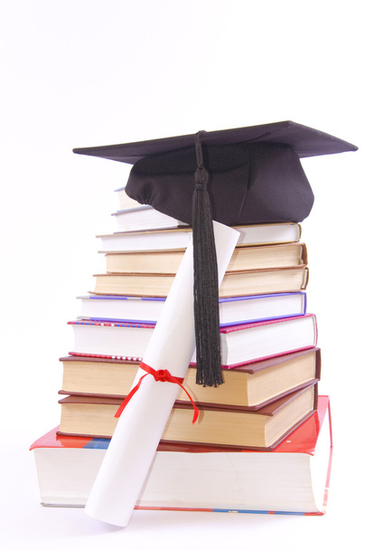 Chapéu de estudante, diploma e livros
 - Foto, Imagem