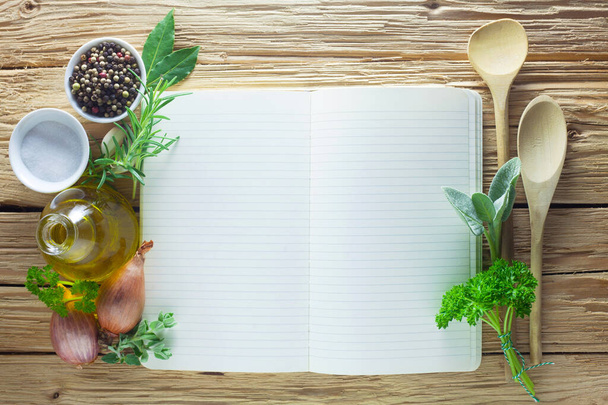 recipe book with spices and herbs on wooden background - Foto, Imagem