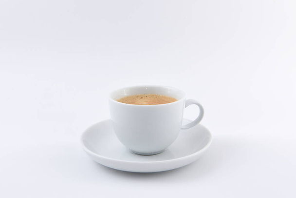 a cup of espresso on a white background - Fotó, kép