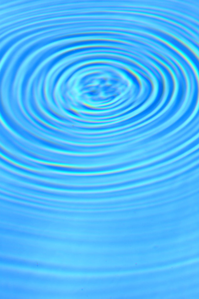 Blue clear water round ripples center background - Photo, Image