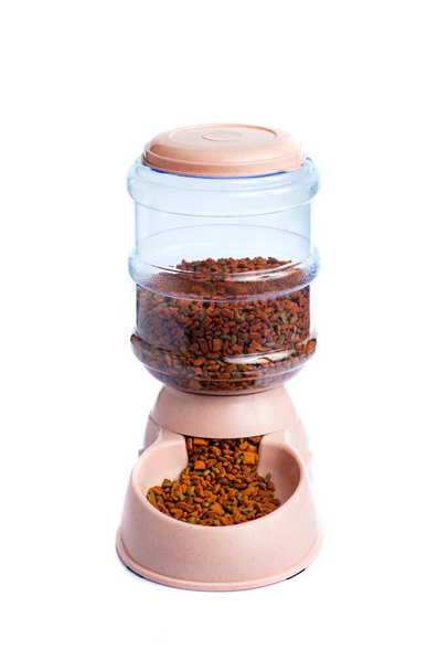 Pet Dry Food Storage Meal Feeder Dispenser or pet food dispenser on a white background - 写真・画像