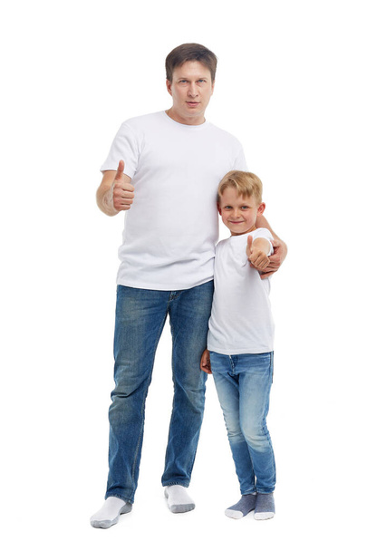 Friendly family. Young man with child stands isolated on a white background. Happy parent. Father with son. Concept of people and family - Foto, afbeelding