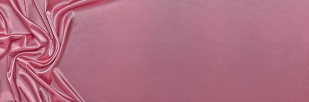 Fondo abstracto de seda rosa o satén. Textura de tela de lujo con drapeado. Vista superior con espacio de copia. Elemento de diseño. Día de San Valentín. - Foto, Imagen