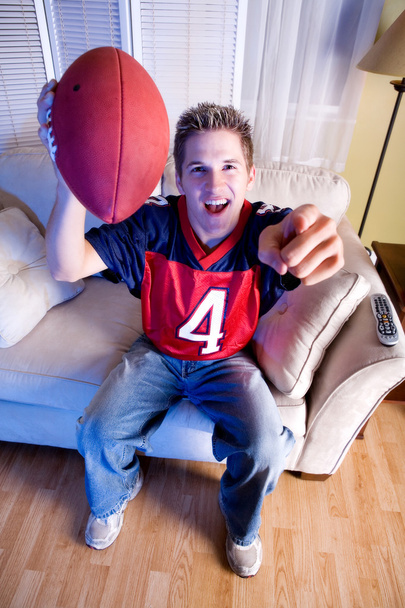 Football: Fan On Couch Cheers For Team - Foto, Imagen