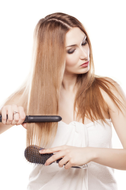 Hair ironing - Zdjęcie, obraz