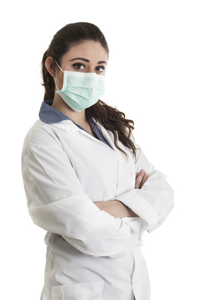 Young beautiful female doctor wearing a mask - Foto, imagen